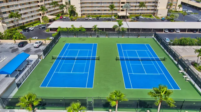 a living room with lots of furniture and a large window