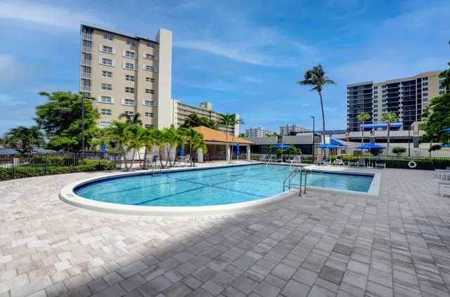a view of a patio with a yard
