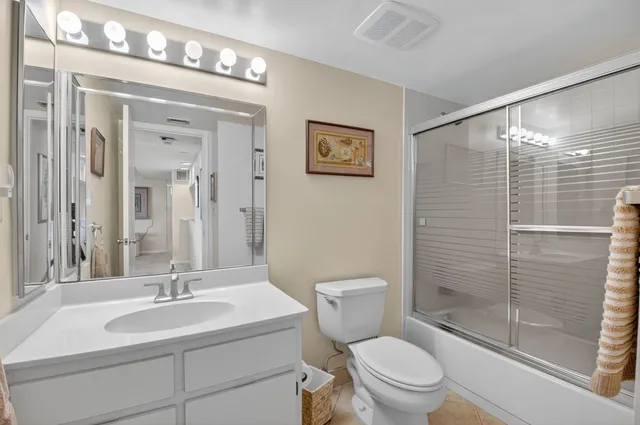 a spacious bathroom with a shower and a sink