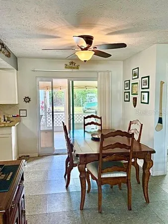 a dining room with furniture and window