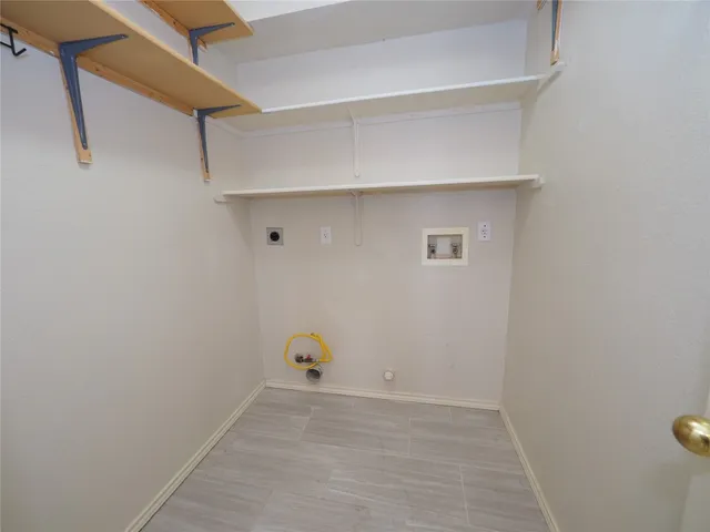 a view of hallway with wooden floor