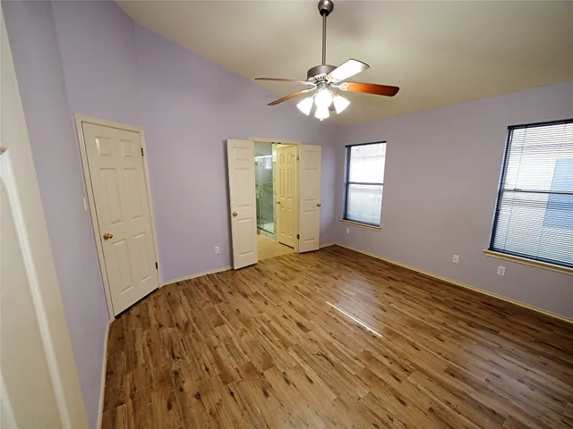a bathroom with a sink a toilet a mirror and shower