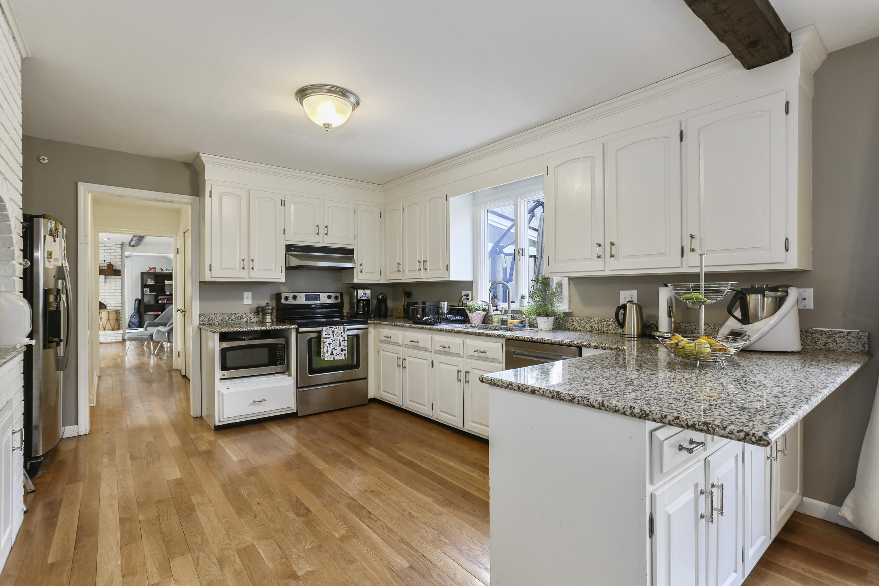 507 Brookside Road New Canaan, CT 06840 - Photo 12 of 36 a kitchen with granite countertop a sink a counter top space and stainless steel appliances