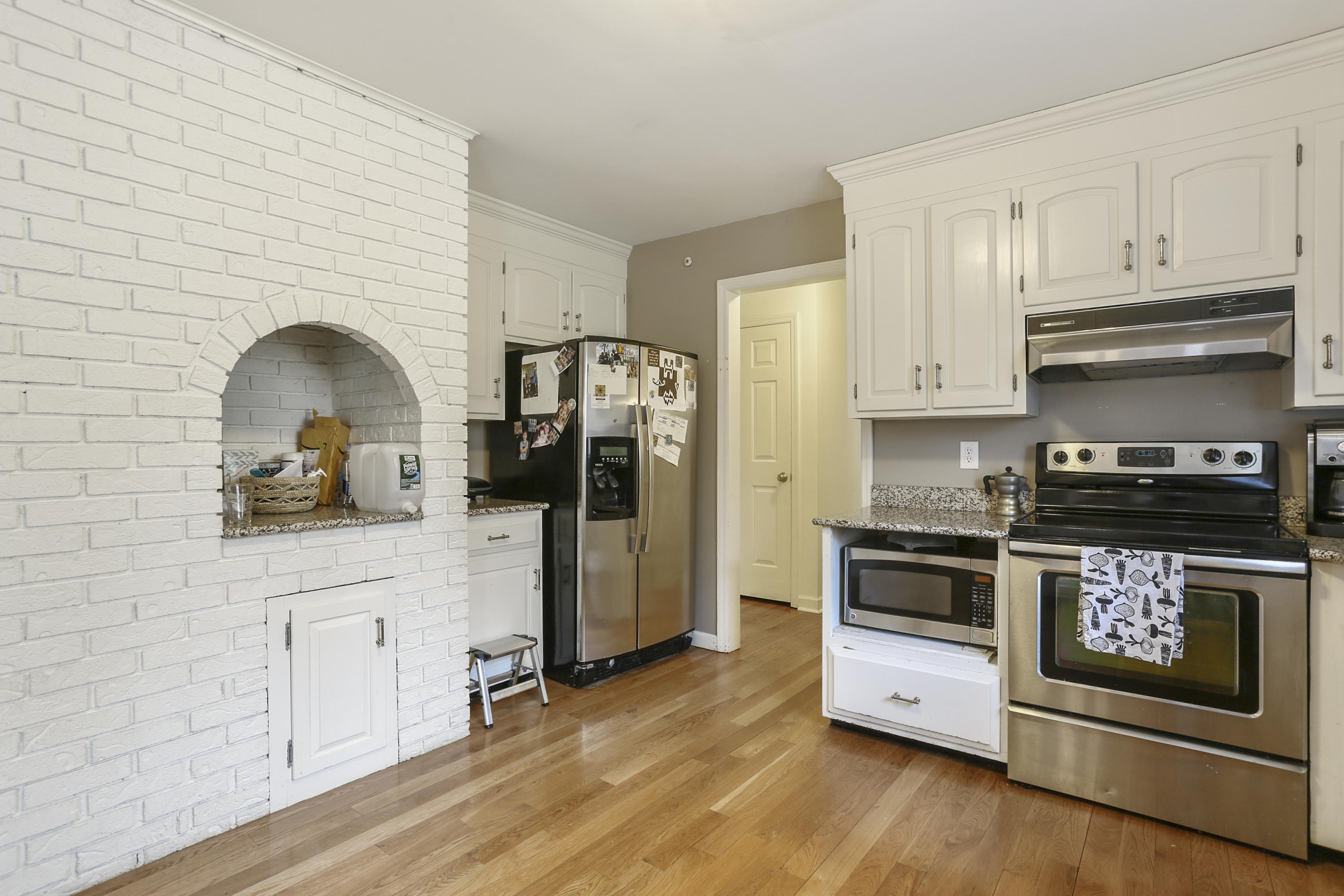 507 Brookside Road New Canaan, CT 06840 - Photo 13 of 36 a kitchen with stainless steel appliances a stove a refrigerator a sink a counter space and cabinets