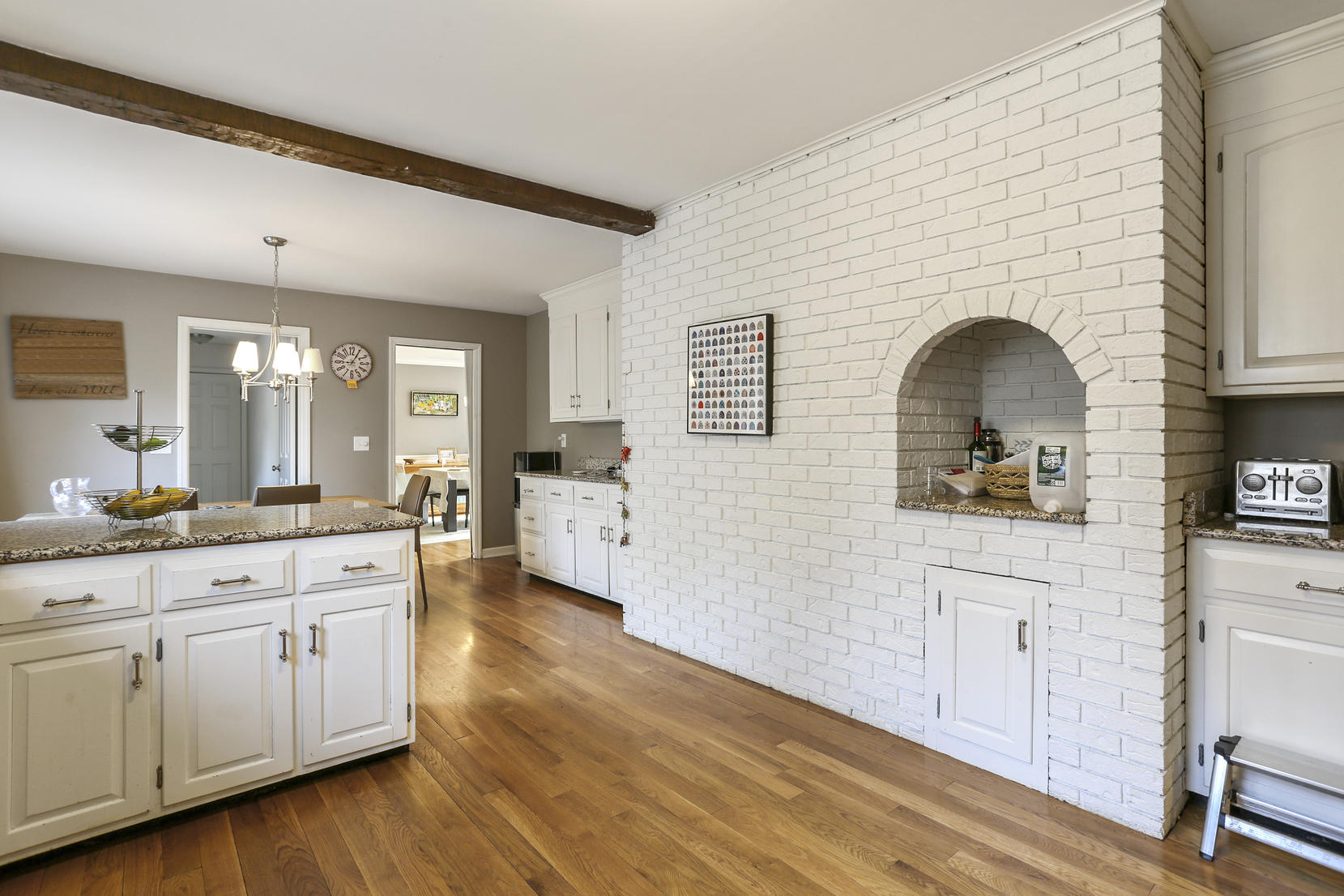 507 Brookside Road New Canaan, CT 06840 - Photo 14 of 36 a kitchen with sink cabinets and wooden floor