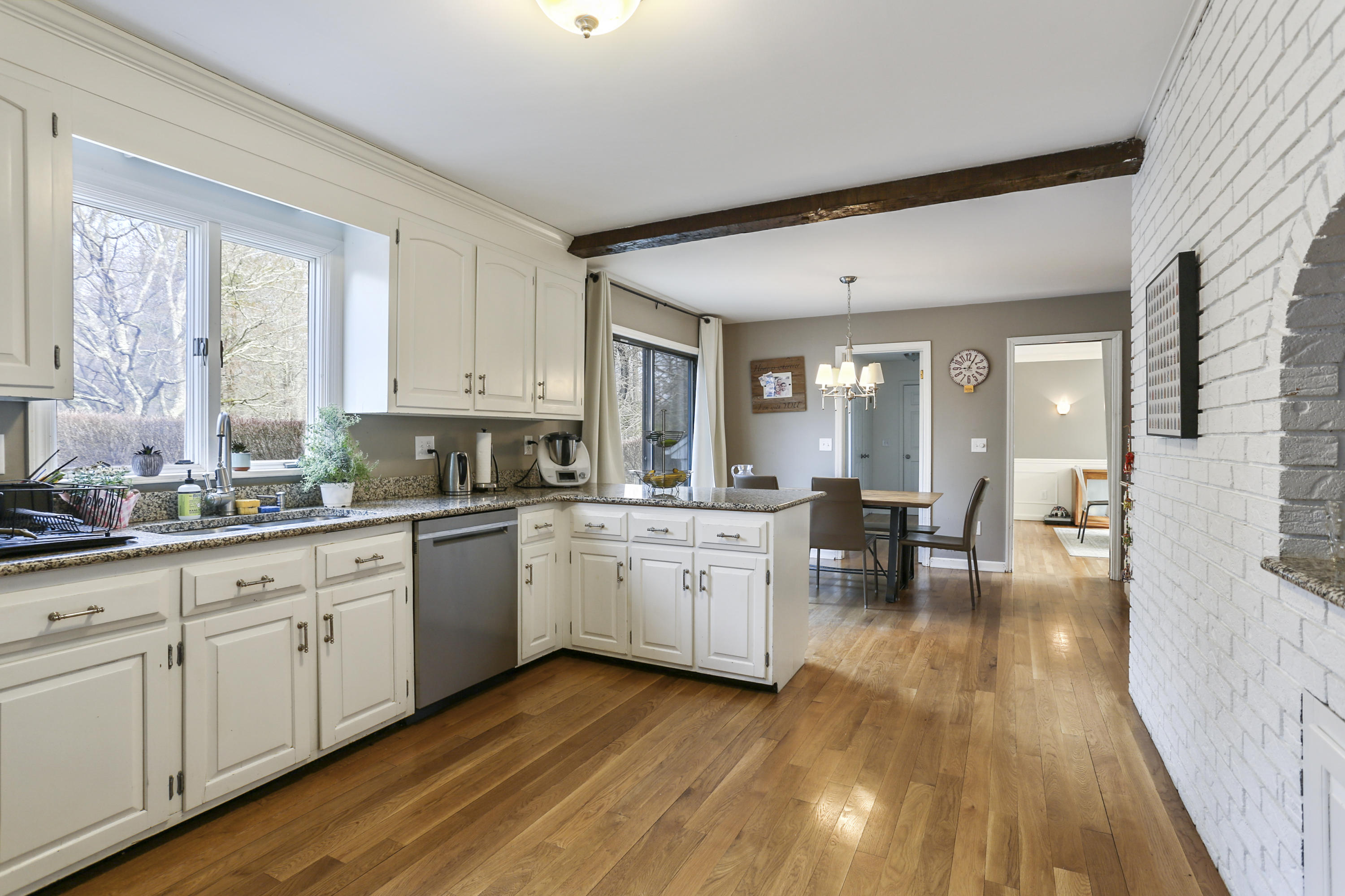 507 Brookside Road New Canaan, CT 06840 - Photo 15 of 36 a open kitchen with sink cabinets and wooden floor