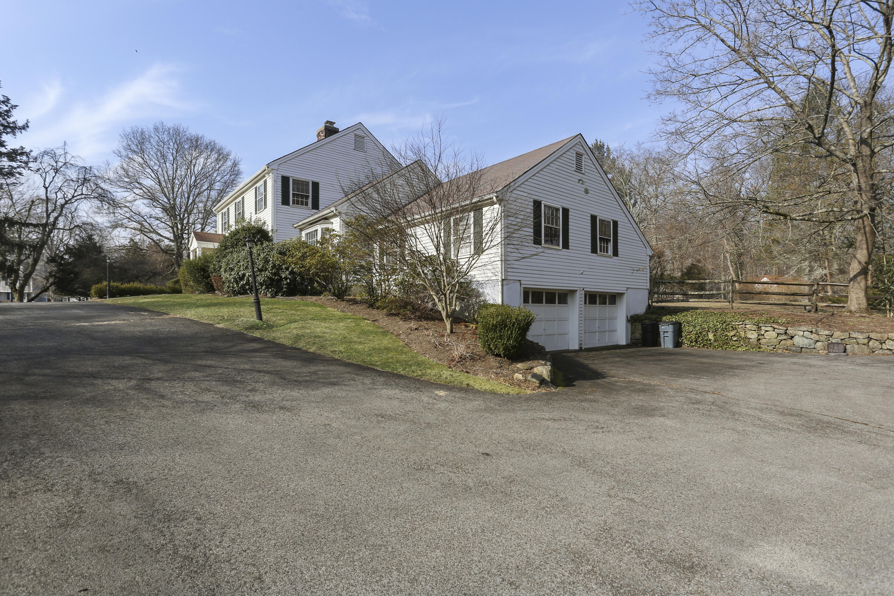 507 Brookside Road New Canaan, CT 06840 - Photo 3 of 36 a view of a house with a yard and large tree