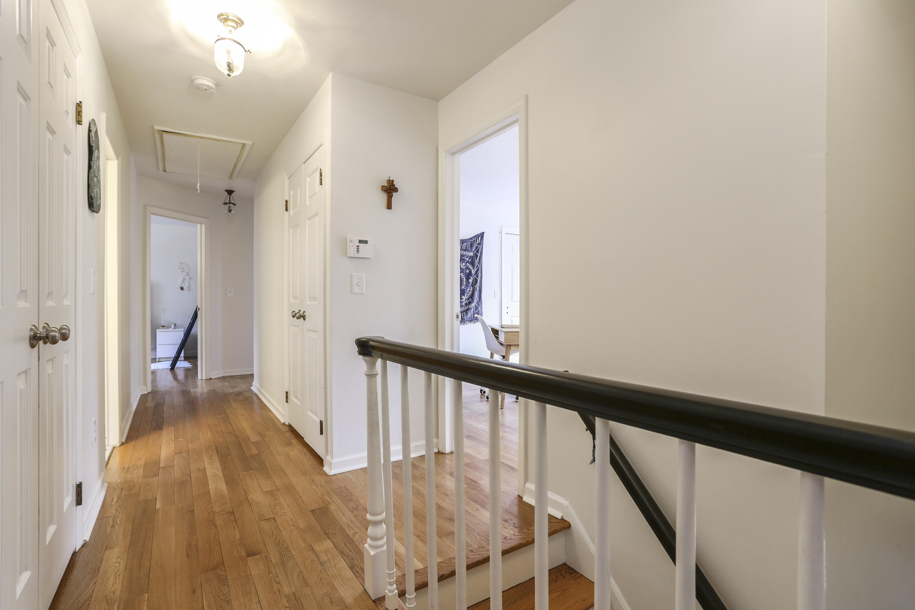 507 Brookside Road New Canaan, CT 06840 - Photo 23 of 36 a view of a hallway with wooden floor and staircase