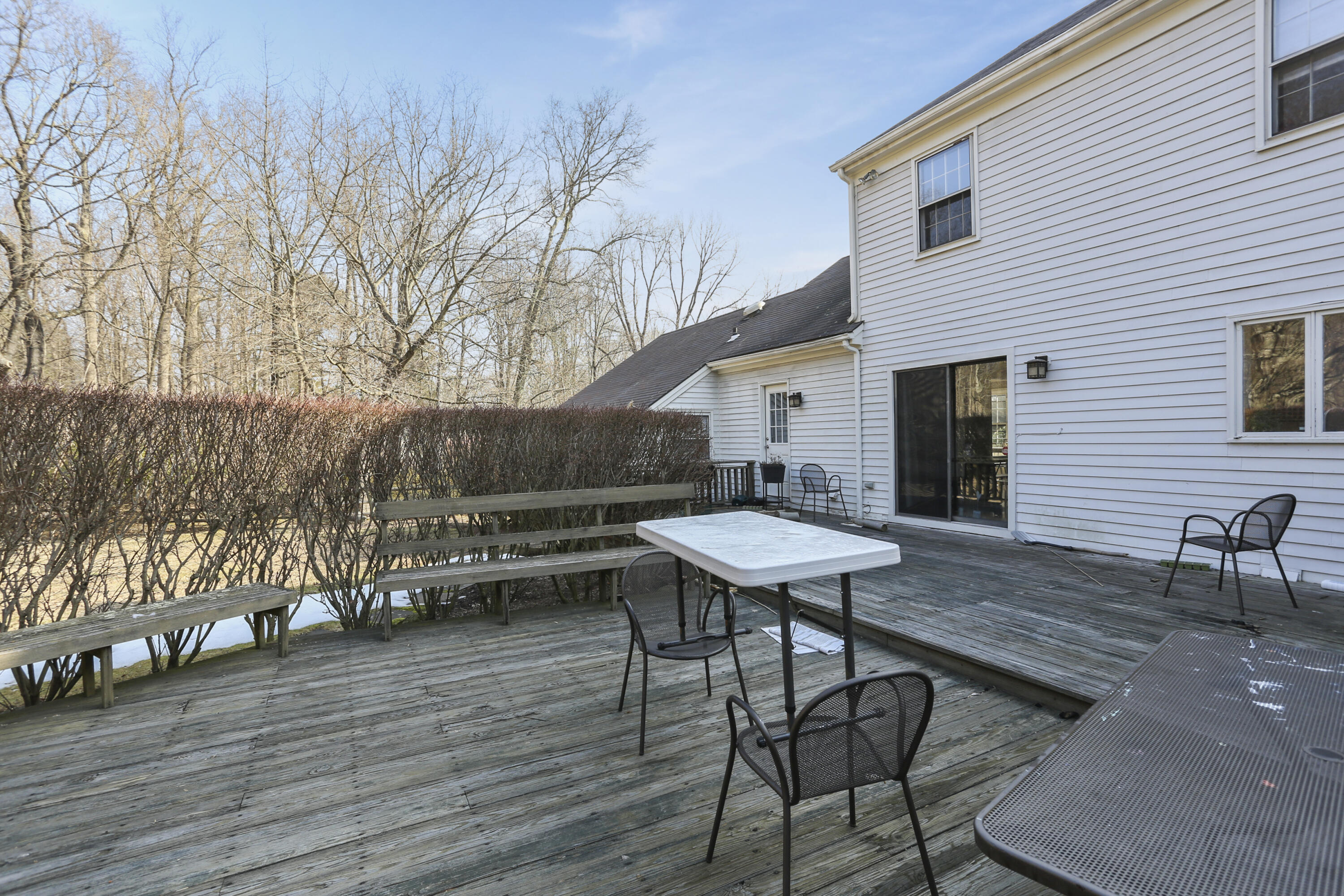 507 Brookside Road New Canaan, CT 06840 - Photo 28 of 36 a balcony with wooden floor table and chairs
