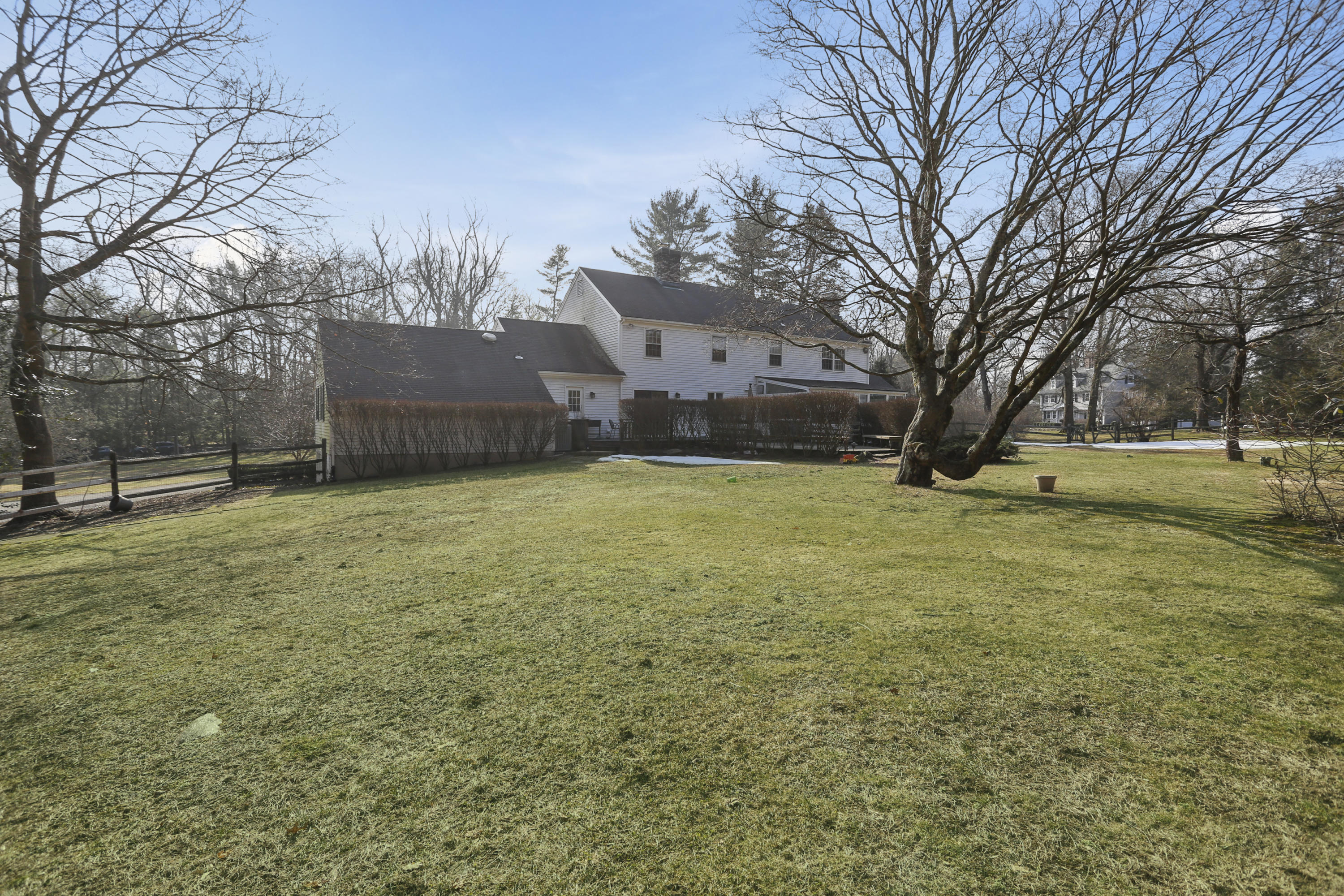 507 Brookside Road New Canaan, CT 06840 - Photo 31 of 36 a view of a yard with a house