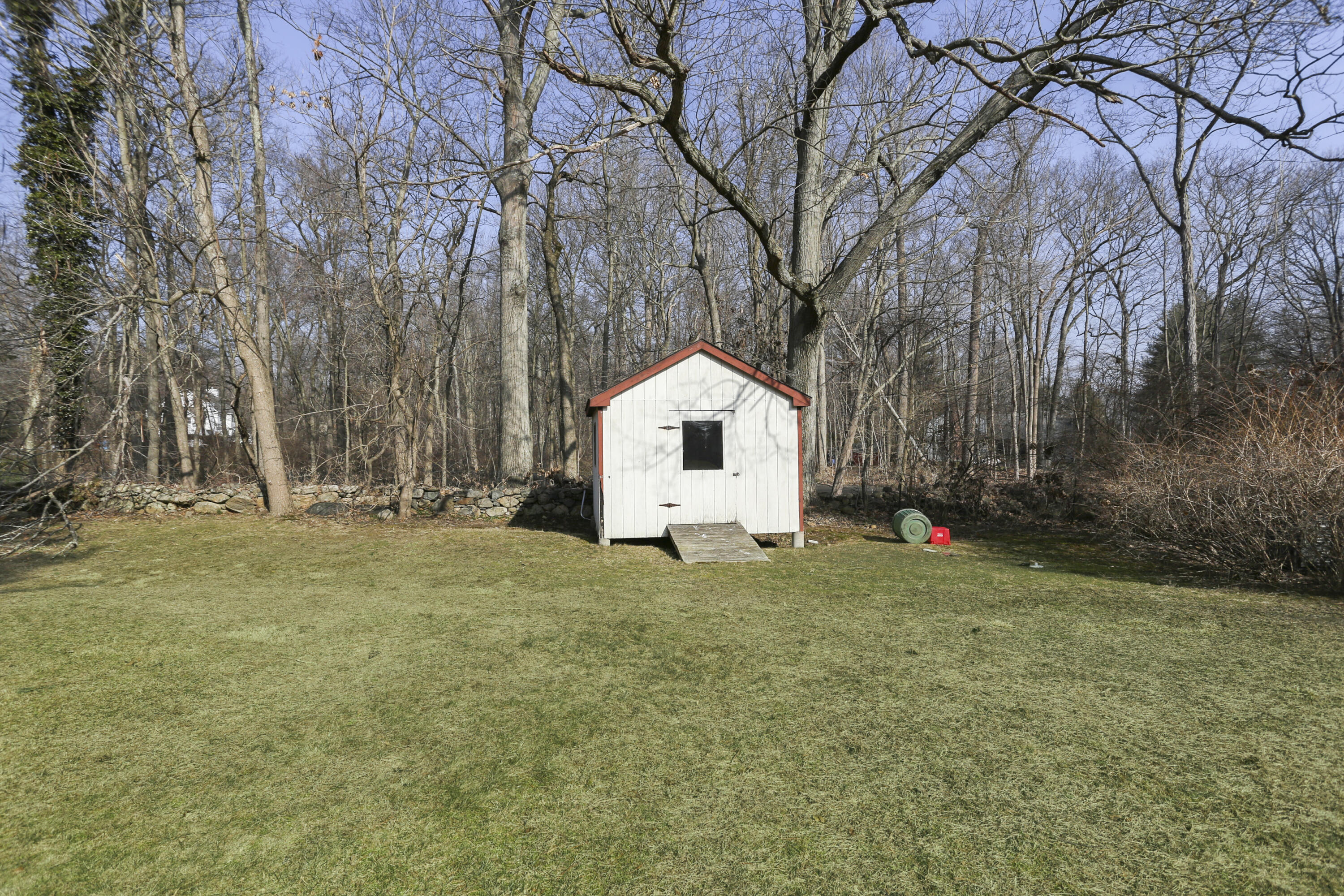 507 Brookside Road New Canaan, CT 06840 - Photo 32 of 36 a white house that has a tree in front of it