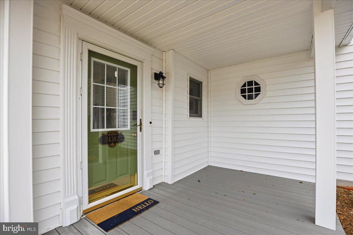 14382 Sedwick Avenue Solomons, MD 20688 - Photo 13 of 90 Front covered porch room enough for furniture