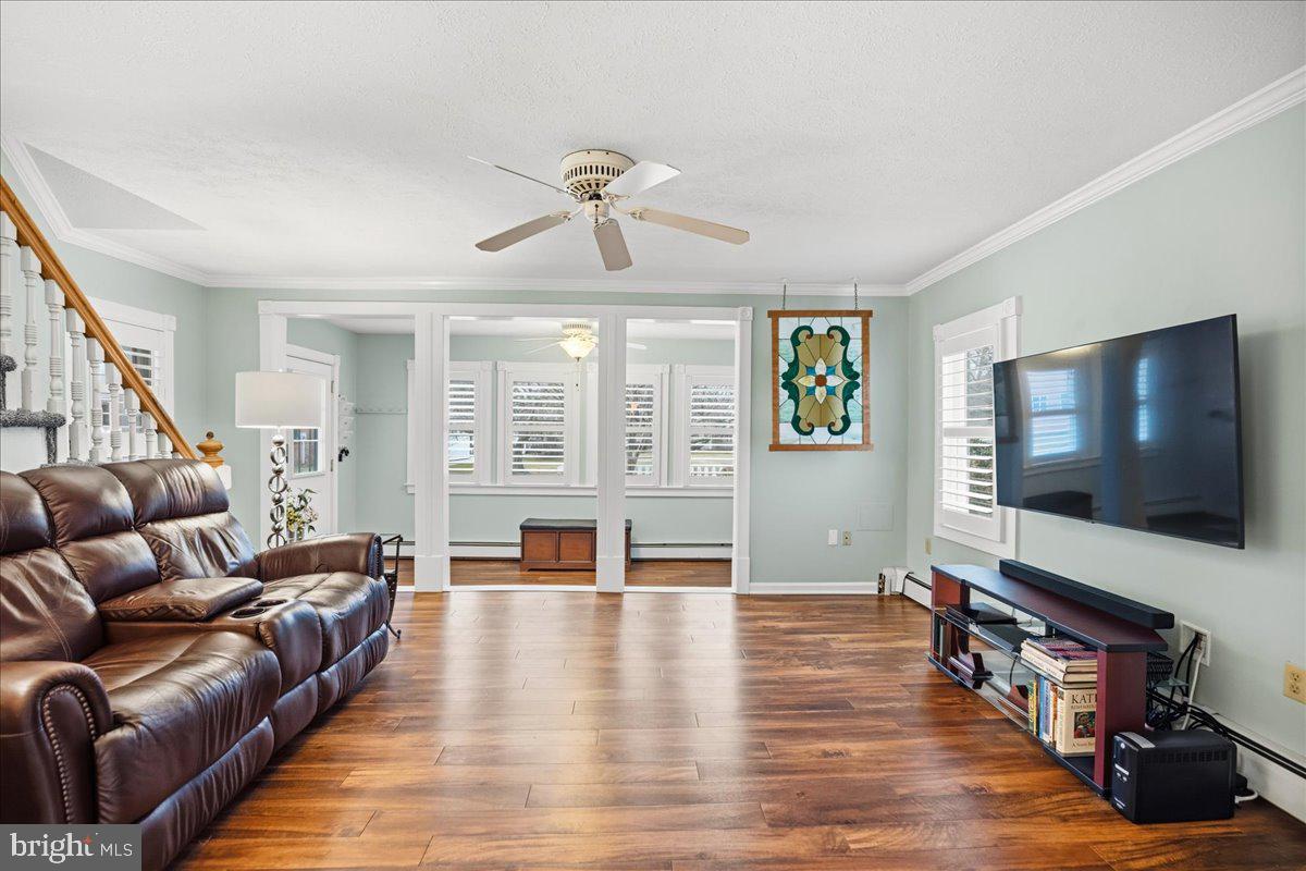 14382 Sedwick Avenue Solomons, MD 20688 - Photo 16 of 90 a living room with furniture and a flat screen tv