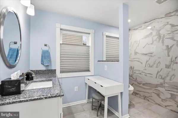 a kitchen with a stove and cabinets