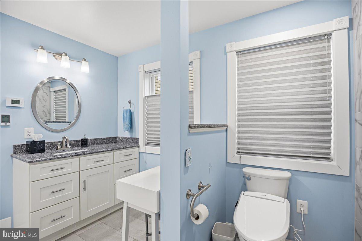14382 Sedwick Avenue Solomons, MD 20688 - Photo 25 of 90 Toilet area with privacy wall