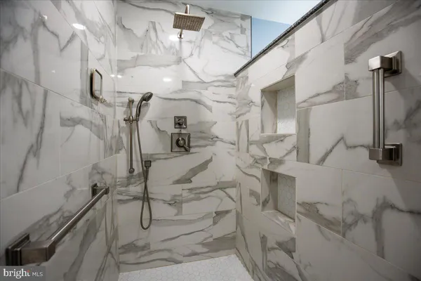 a kitchen with a sink and a stove with cabinets