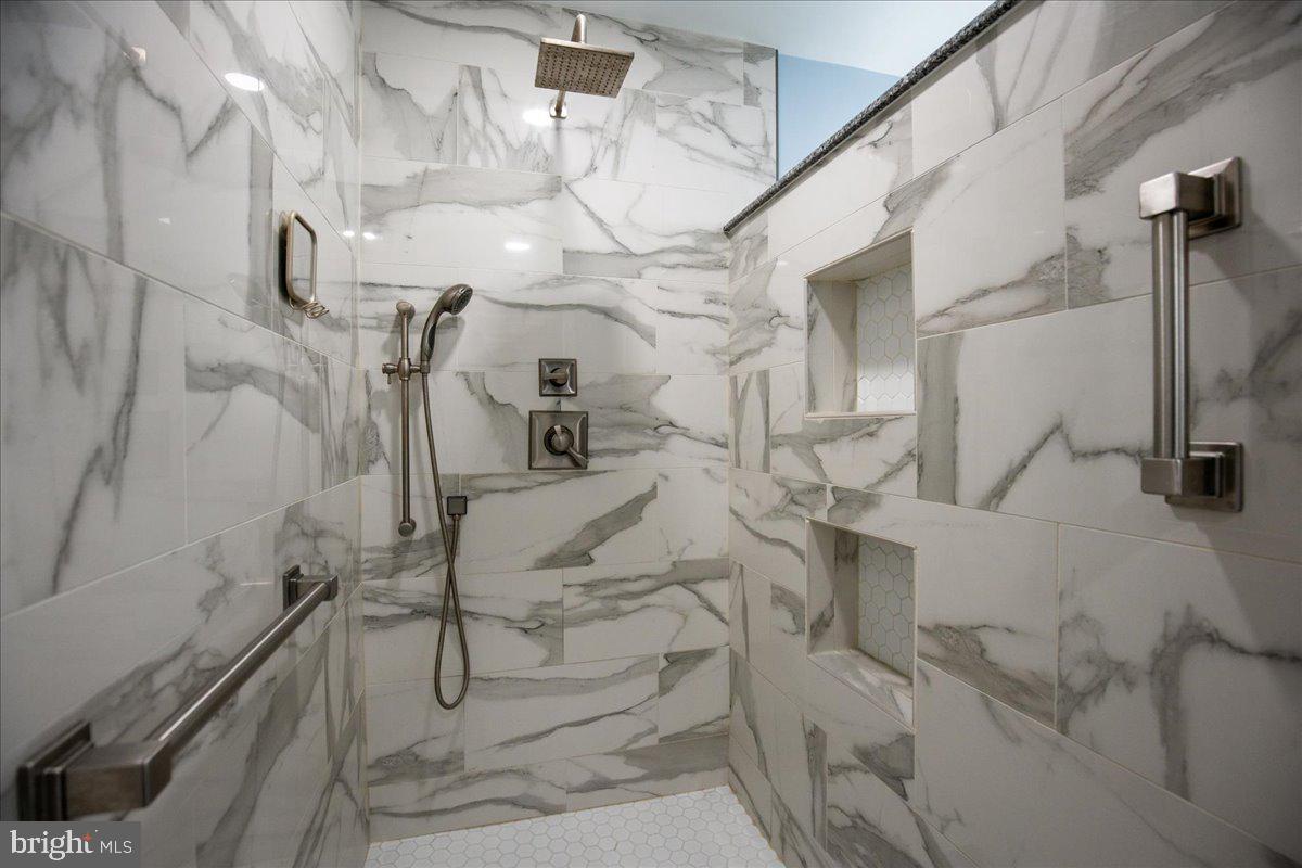 14382 Sedwick Avenue Solomons, MD 20688 - Photo 26 of 90 Look at that rain head and shelving in the wall