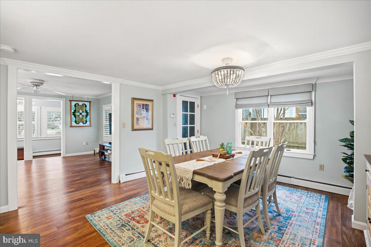 14382 Sedwick Avenue Solomons, MD 20688 - Photo 27 of 90 a view of a dining room with furniture window and wooden floor