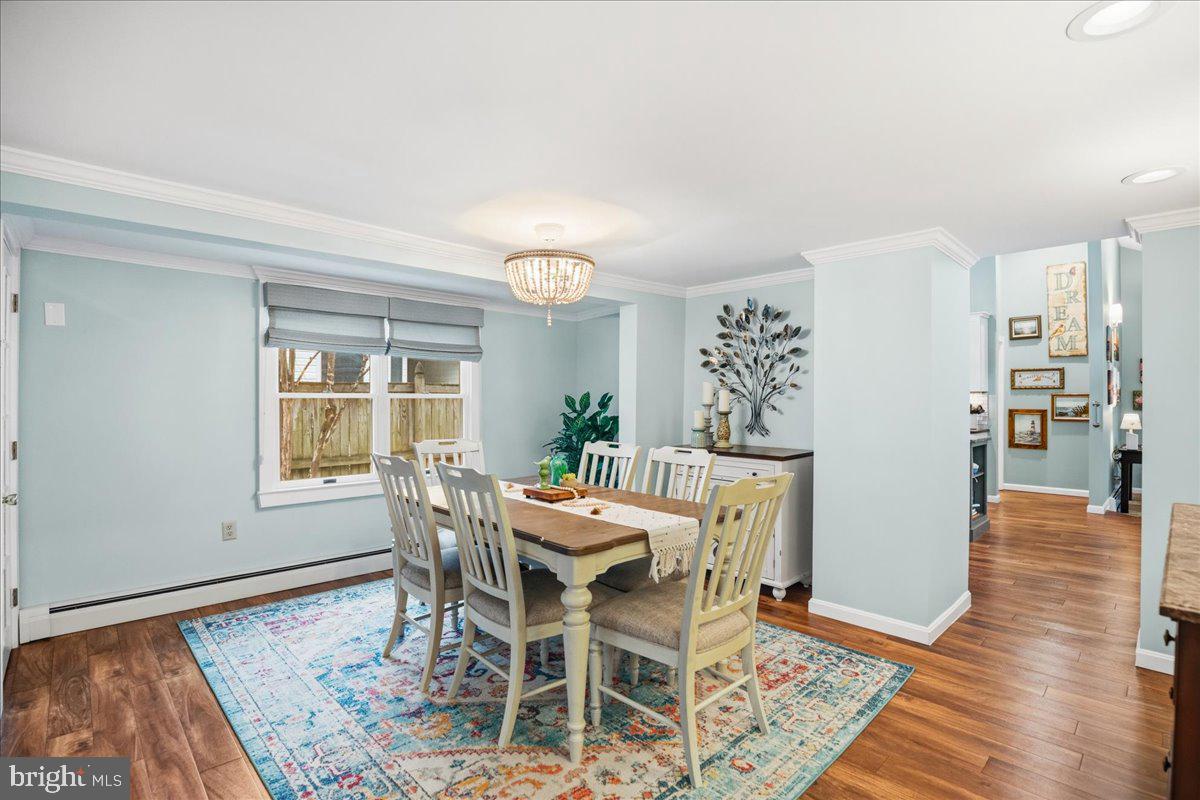 14382 Sedwick Avenue Solomons, MD 20688 - Photo 28 of 90 a dining room with furniture and wooden floor