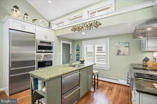a living room filled with furniture and a large window