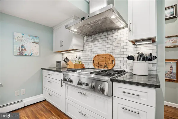 a backyard of a house with large trees