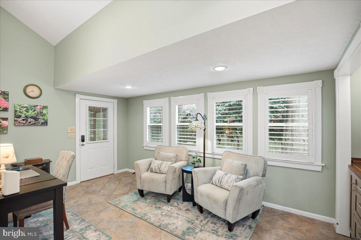 14382 Sedwick Avenue Solomons, MD 20688 - Photo 38 of 90 a living room with furniture and a window