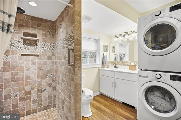 a view of living room filled with furniture and large window