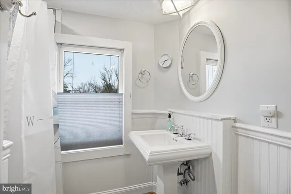 a view of a chair and table on the wooden floor