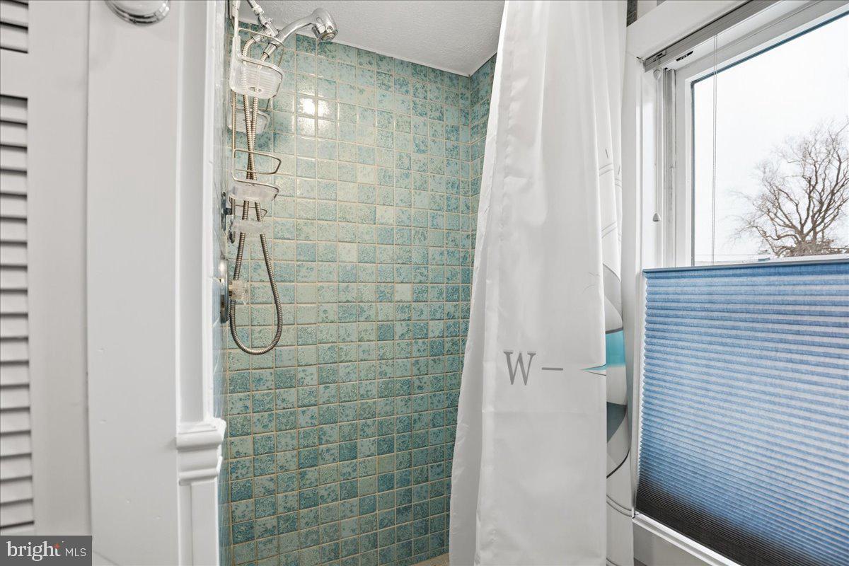 14382 Sedwick Avenue Solomons, MD 20688 - Photo 48 of 90 Fully tiled shower for guests
