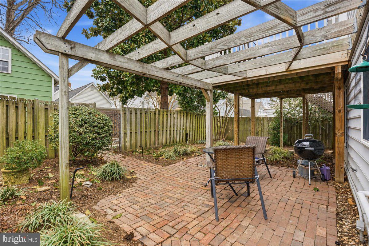 14382 Sedwick Avenue Solomons, MD 20688 - Photo 63 of 90 a roof deck with table and chairs and potted plants