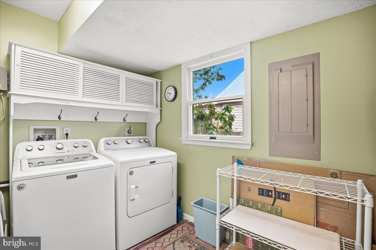 14382 Sedwick Avenue Solomons, MD 20688 - Photo 68 of 90 a utility room with dryer and washer