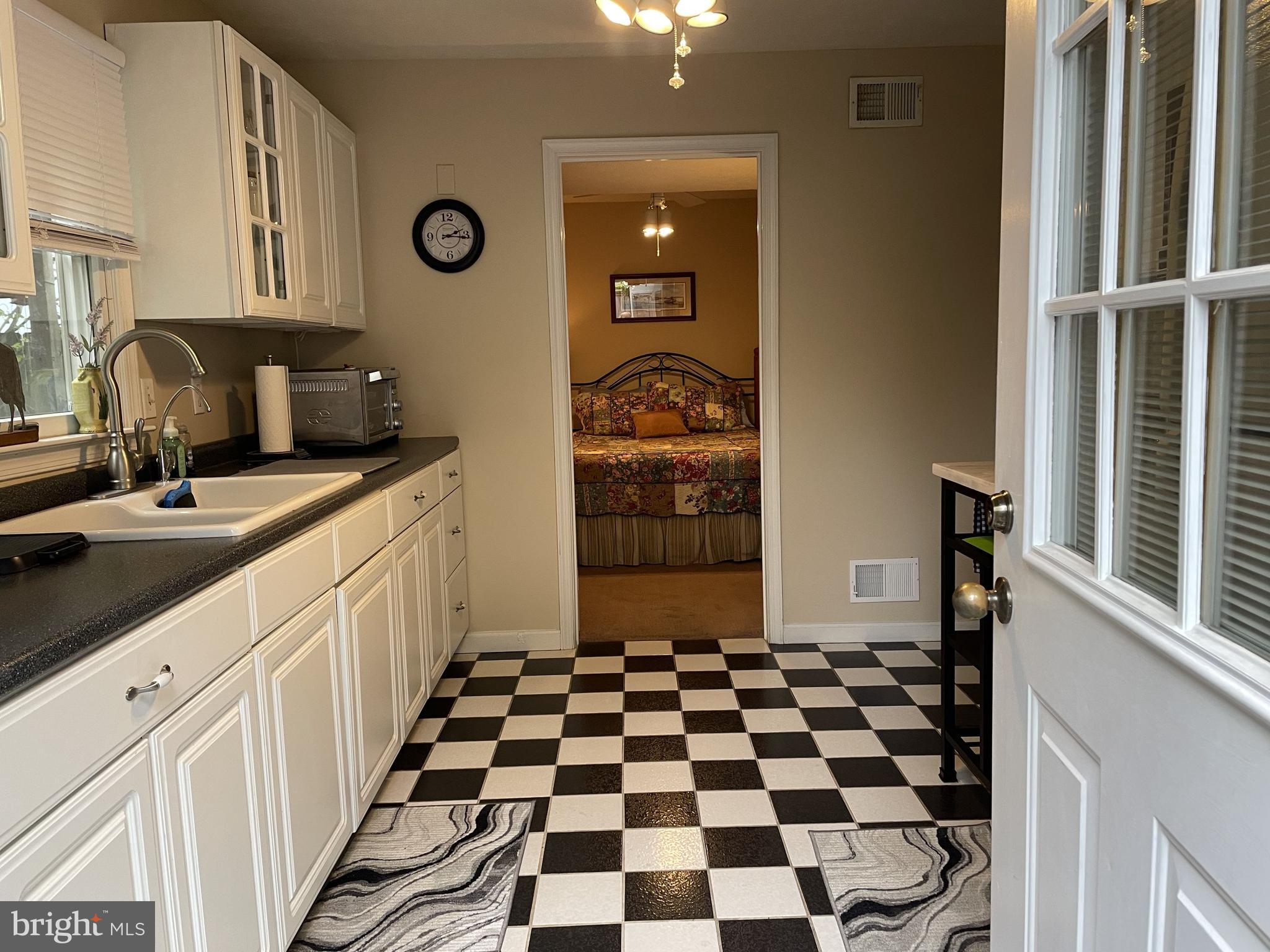 14382 Sedwick Avenue Solomons, MD 20688 - Photo 82 of 90 Wet bar area through to bedroom suite