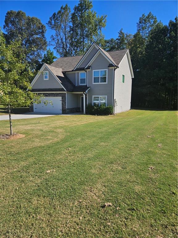 958 Fellowship Road Fairburn, GA 30213 - Photo 1 of 1 a view of a house with a yard