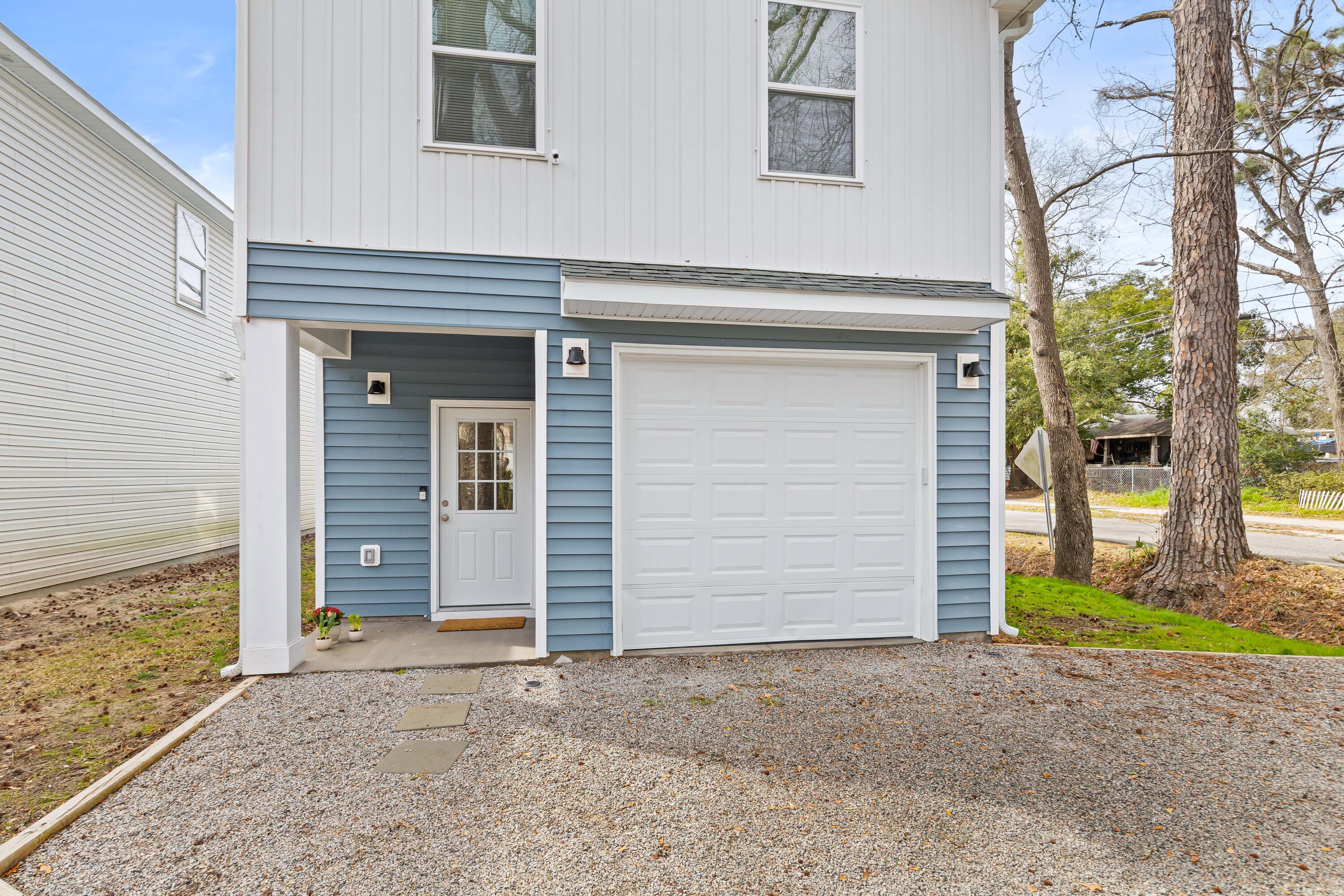 5760 Pilgrim Avenue Hanahan, SC 29410 - Photo 32 of 34 Front patio and driveway entrance