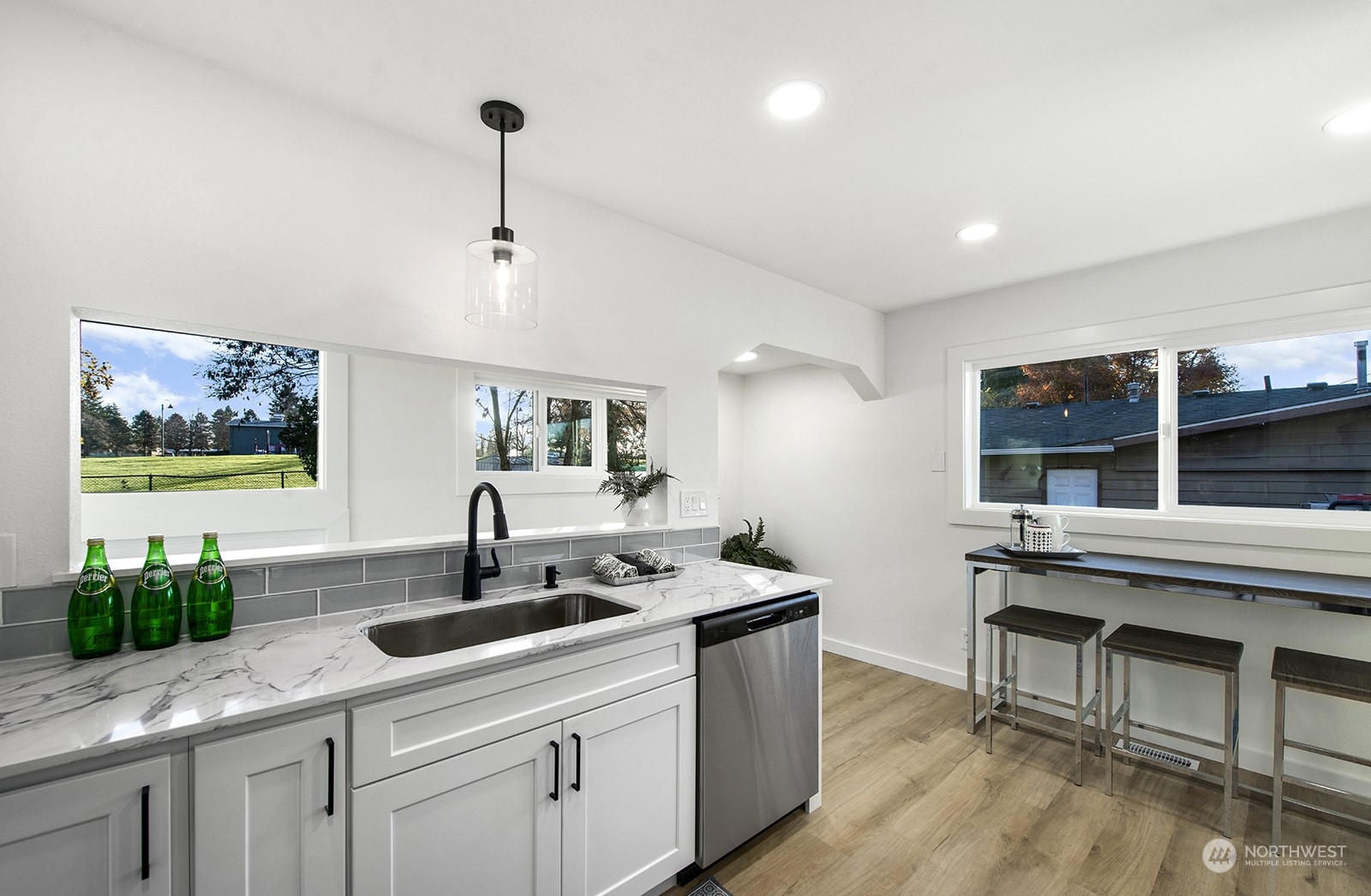 2601 Northeast 9th Street Renton, WA 98056 - Photo 16 of 34 a kitchen with stainless steel appliances granite countertop a sink and a stove
