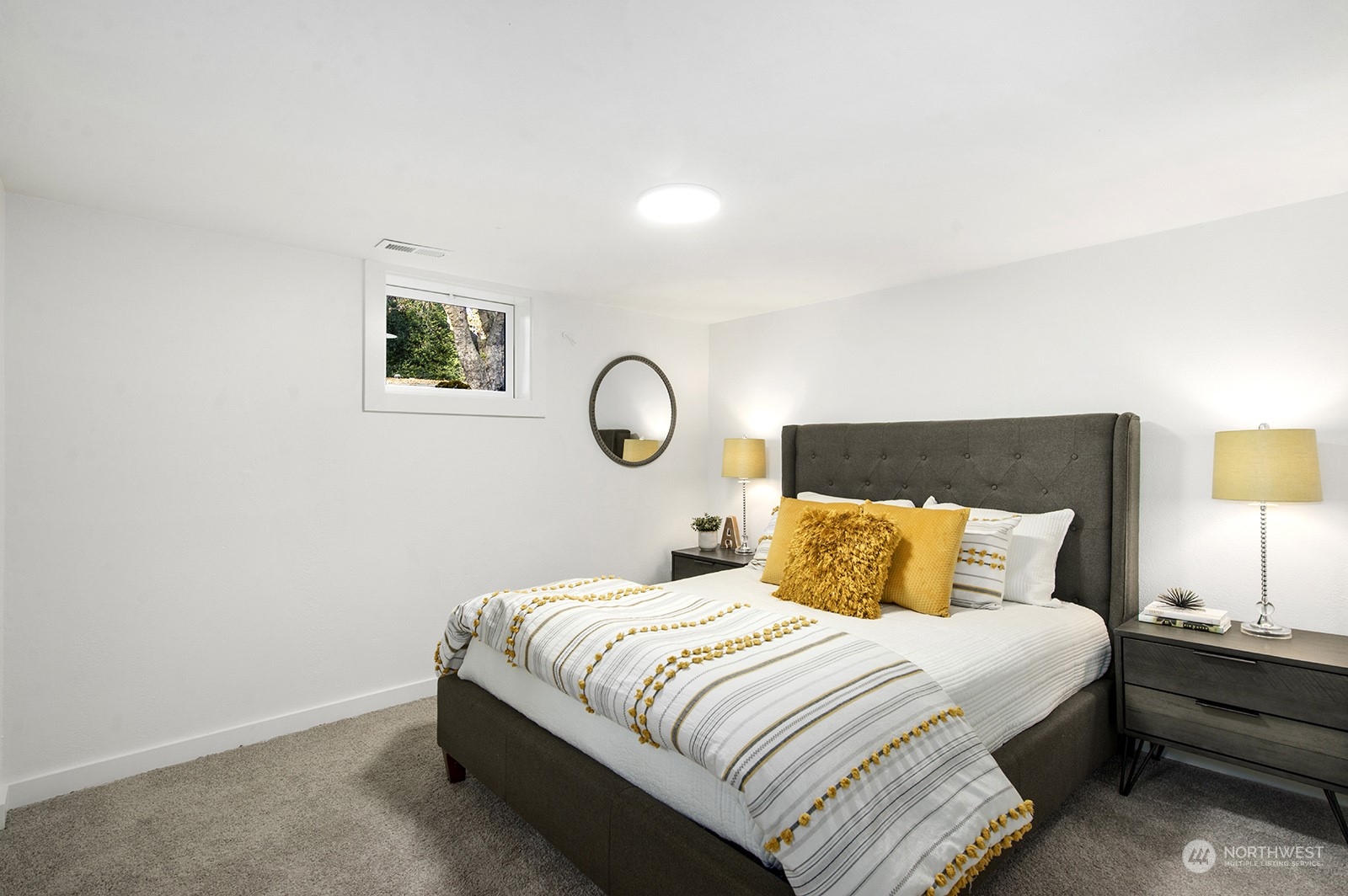 2601 Northeast 9th Street Renton, WA 98056 - Photo 24 of 34 a bedroom with a bed and lamps