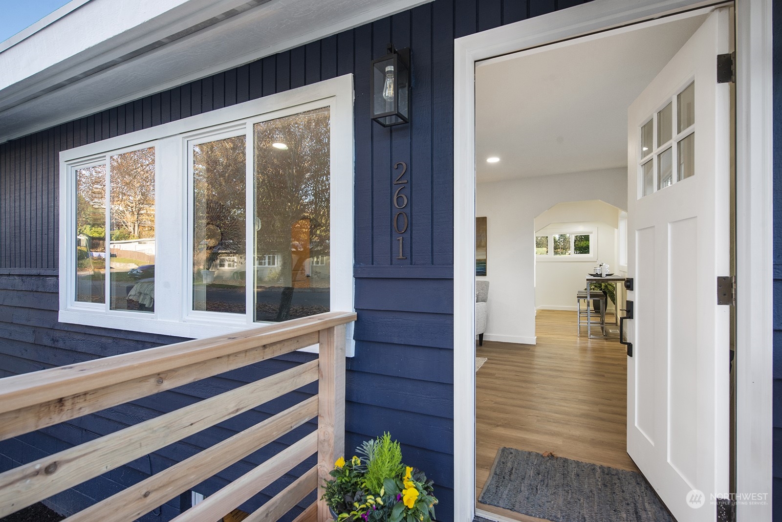 2601 Northeast 9th Street Renton, WA 98056 - Photo 3 of 34 a view of front door of house with wooden floor and a porch