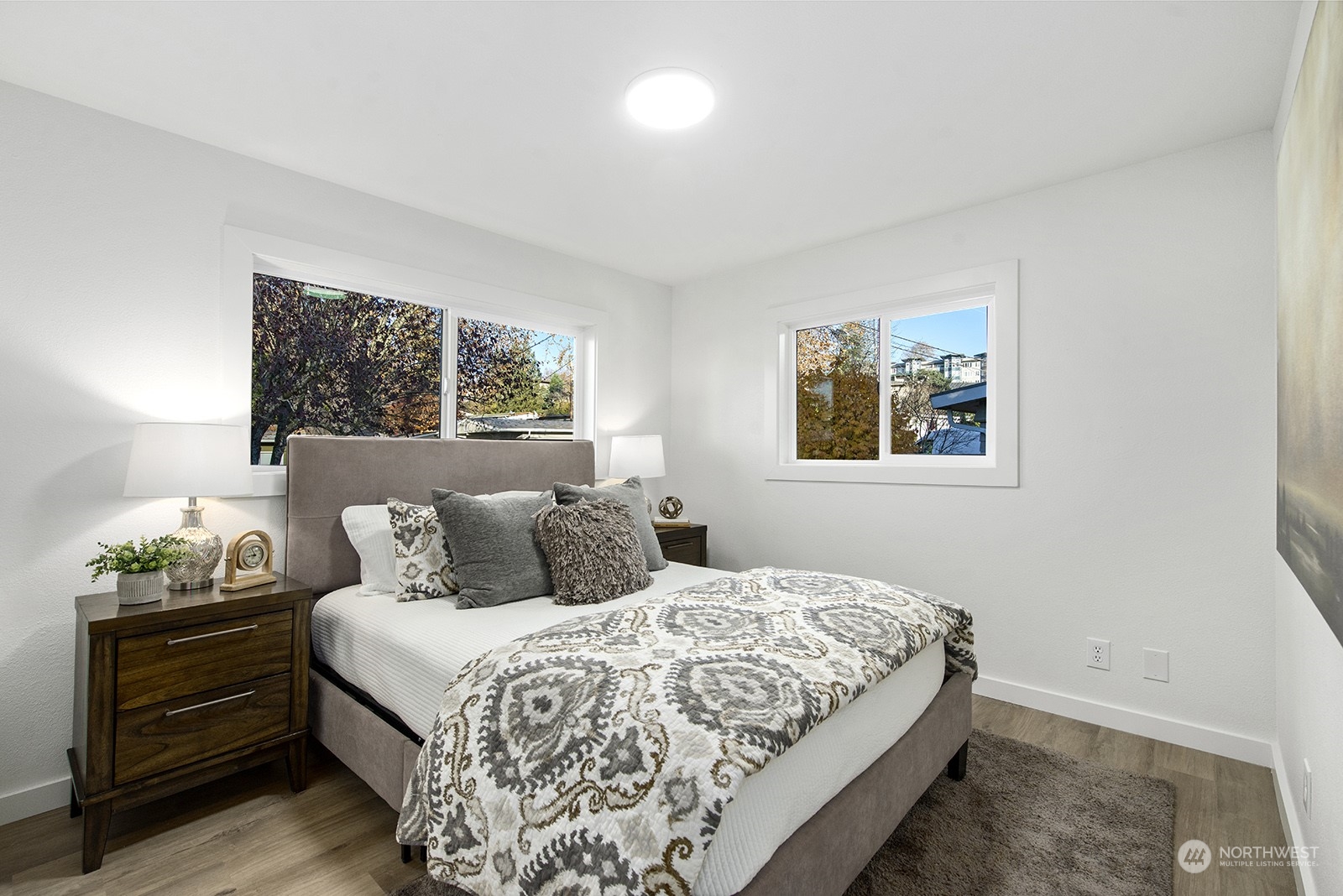 2601 Northeast 9th Street Renton, WA 98056 - Photo 8 of 34 a bedroom with a bed and a painting on the wall