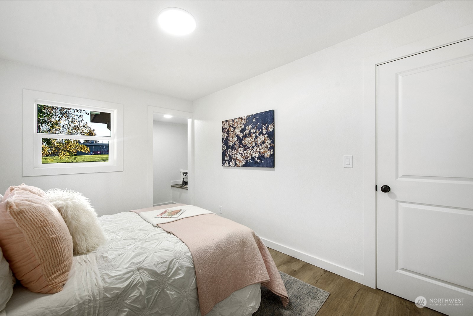 2601 Northeast 9th Street Renton, WA 98056 - Photo 10 of 34 a bedroom with bed and a window