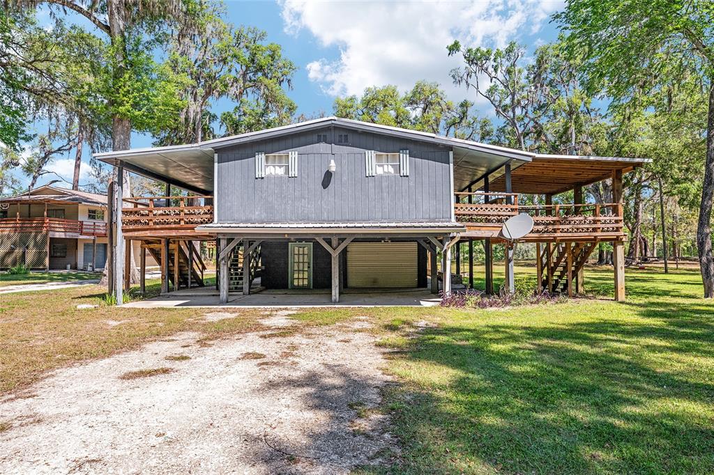 7870 Southwest 25th Place Bell, FL 32619 - Photo 29 of 99 a front view of a house with a yard