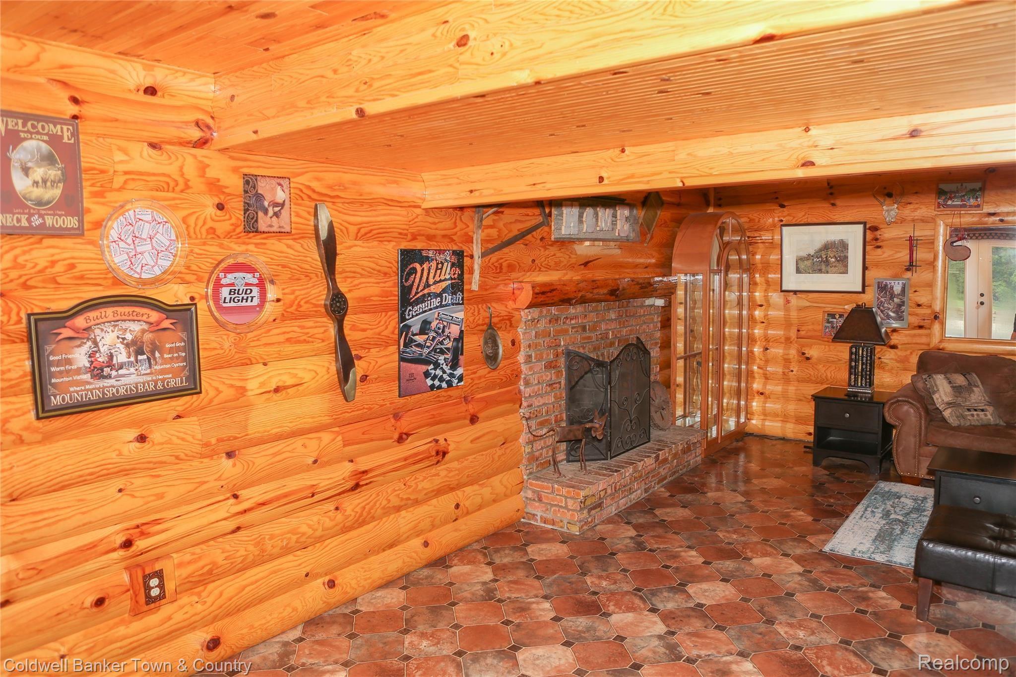 3188 West Coon Lake Road Howell, MI 48843 - Photo 55 of 65 Natural fireplace in lower level family room