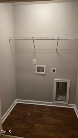 a view of a room with wooden floor and fireplace