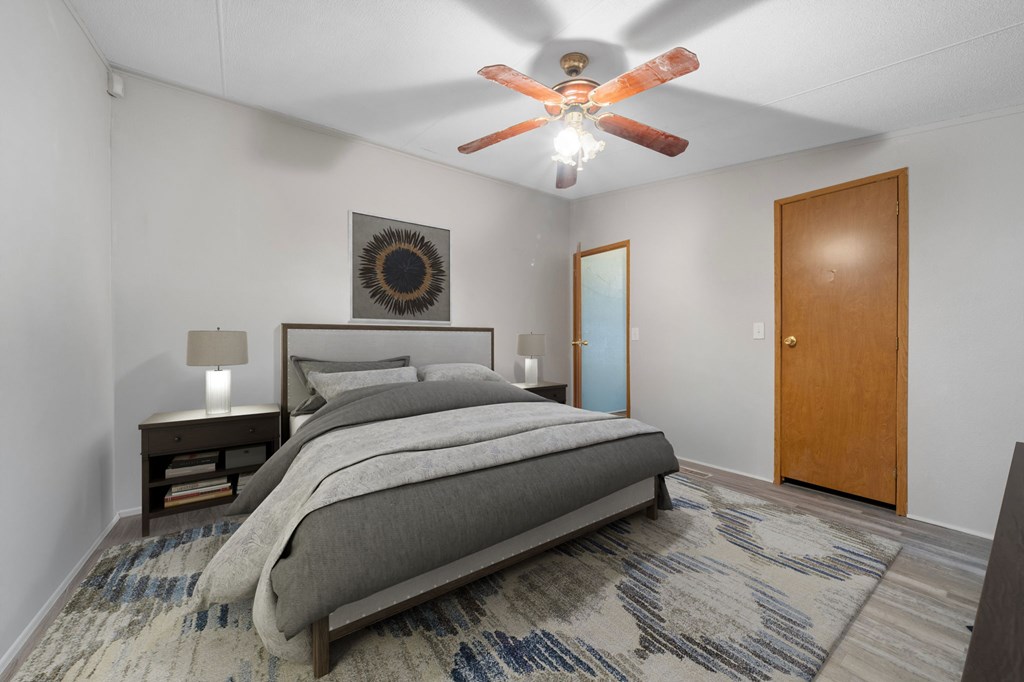 150 Curtis Switch Road Blue Ridge, GA 30513 - Photo 21 of 37 a bedroom with a bed and a chandelier