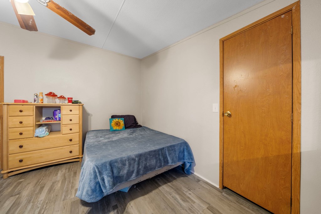 150 Curtis Switch Road Blue Ridge, GA 30513 - Photo 25 of 37 a bedroom with a bed and wooden floor