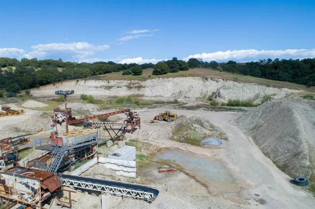an aerial view of a swimming pool and mountain view