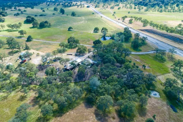 an aerial view of a house with a garden