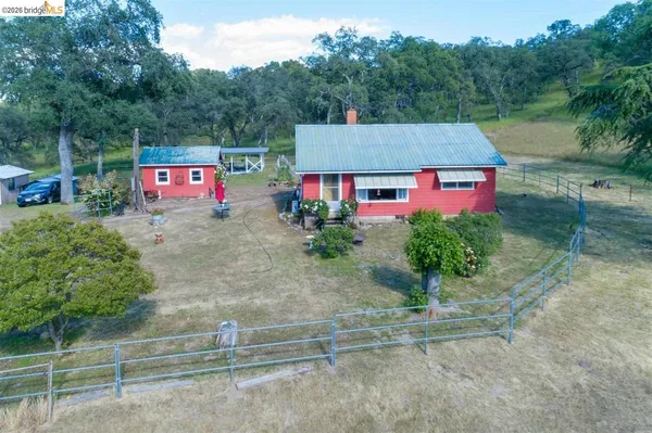 an aerial view of a house with a garden