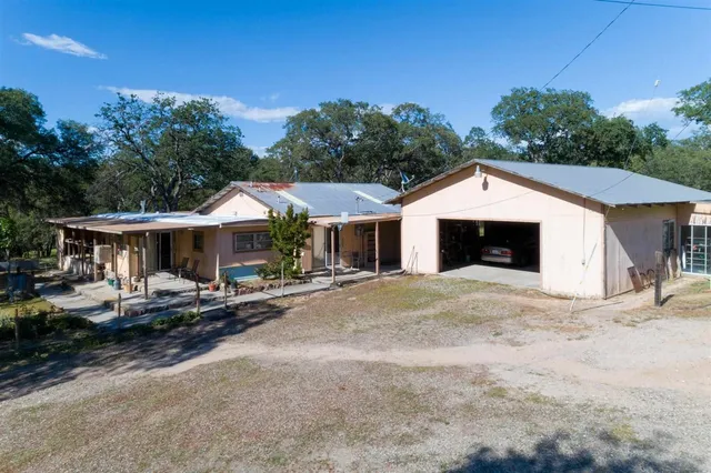 a view of a lush green outdoor space with a lake view