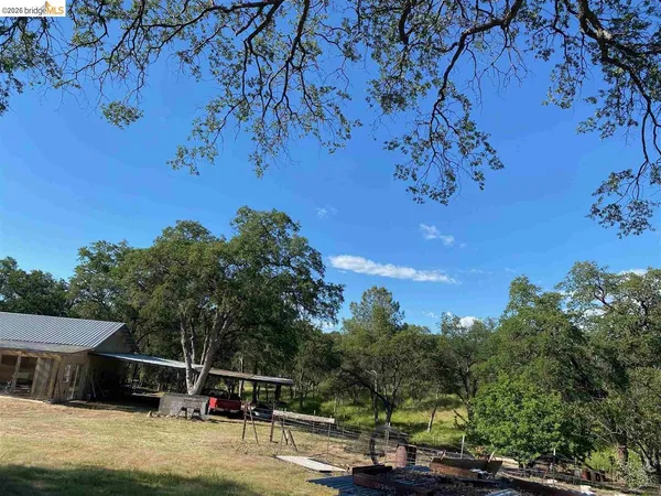 a view of a lake with a yard