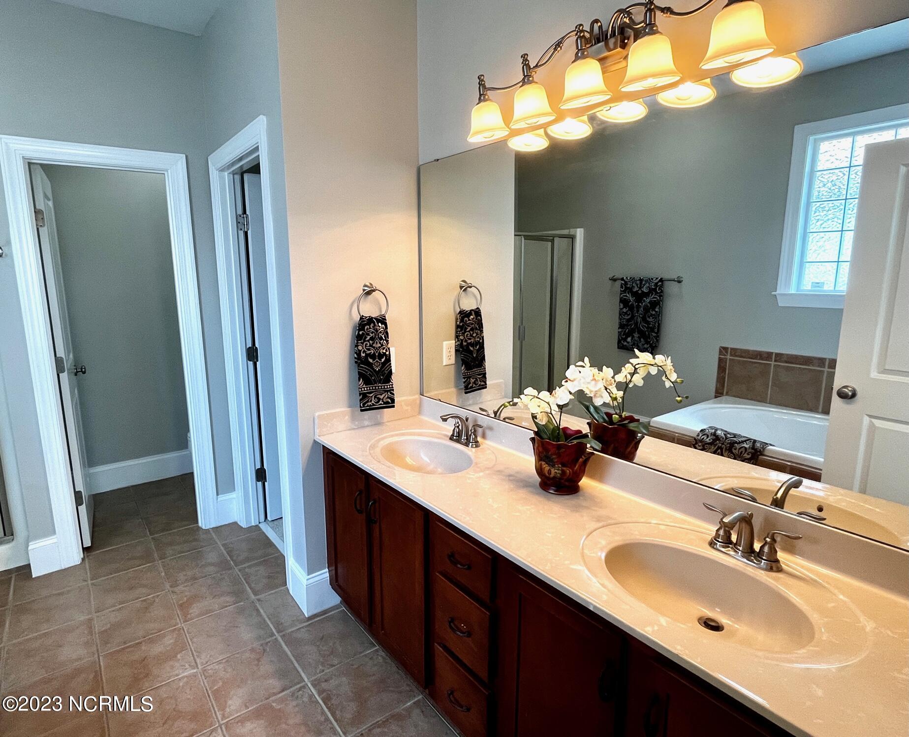 7176 Bonaventure Street Southwest Ocean Isle Beach, NC 28469 - Photo 21 of 30 61 Master Bath